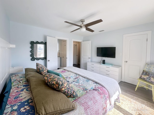 372 E Beach Blvd Unit 14, Gulf Shores, AL 36542 - bedroom with wood finished floors and ceiling fan
