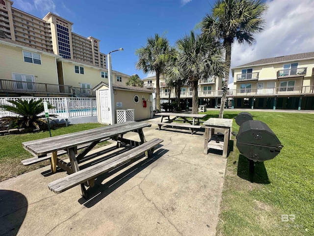 372 E Beach Blvd Unit 14, Gulf Shores, AL 36542 - surrounding community featuring a yard and a pool