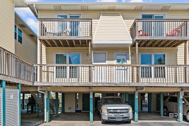 372 E Beach Blvd Unit 14, Gulf Shores, AL 36542 - view of building exterior featuring covered parking and stairway