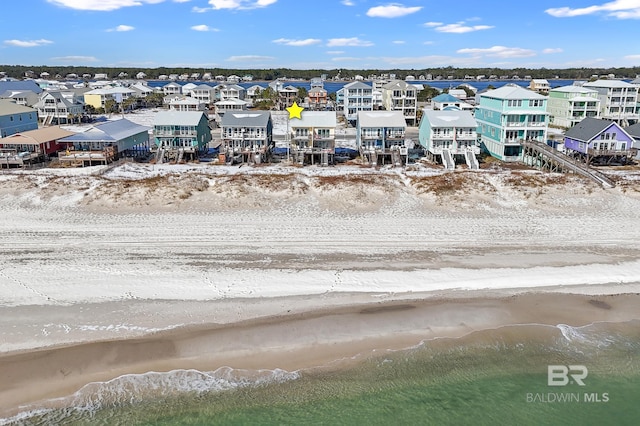 drone / aerial view featuring a view of the beach and a water view