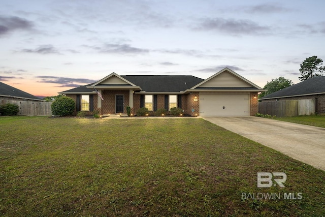 12960 Westfield Loop, Lillian, AL 36549 - view of front facade featuring brick siding, concrete driveway, and an attached garage