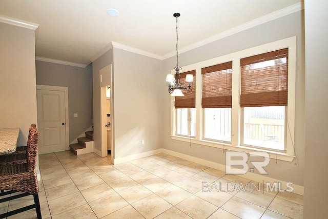 unfurnished dining area with tile patterned floors, a notable chandelier, and ornamental molding