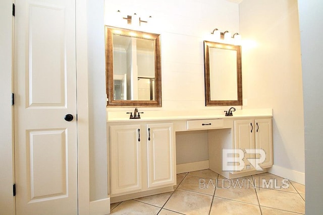 bathroom with tile patterned flooring and vanity