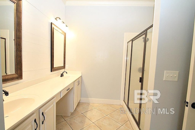 bathroom featuring tile patterned floors, vanity, and a shower with shower door