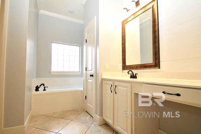 bathroom featuring a bathing tub, tile patterned flooring, crown molding, and vanity