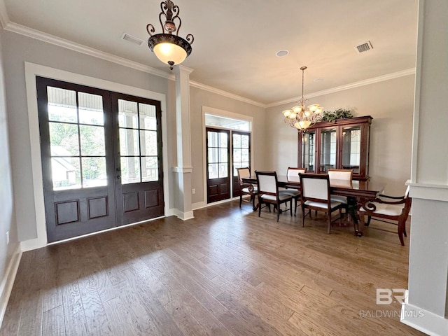 dining area featuring french doors, dark hardwood / wood-style floors, and plenty of natural light