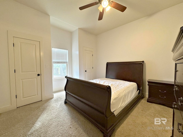 bedroom with light carpet and ceiling fan