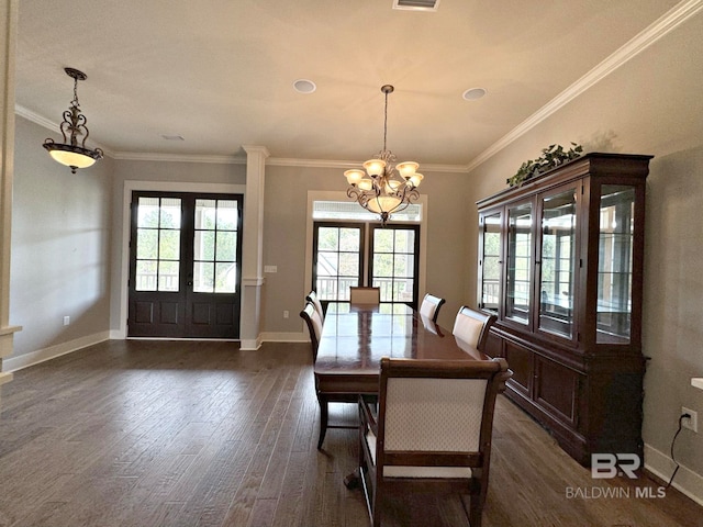 unfurnished dining area featuring crown molding, dark hardwood / wood-style flooring, a healthy amount of sunlight, and an inviting chandelier