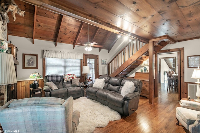 living room featuring wooden ceiling, wood-type flooring, ceiling fan, and vaulted ceiling with beams