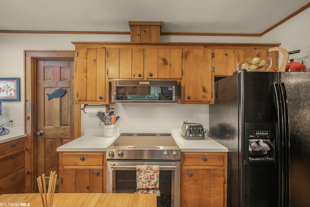 kitchen with ornamental molding and stainless steel appliances