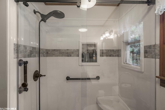 bathroom with walk in shower and tile walls