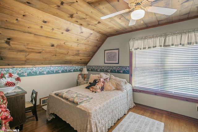 bedroom featuring hardwood / wood-style flooring, lofted ceiling, ceiling fan, and wooden ceiling