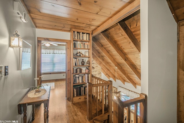 hall featuring wooden ceiling, hardwood / wood-style floors, and lofted ceiling with beams