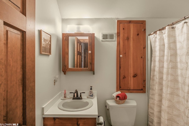 bathroom with oversized vanity and toilet