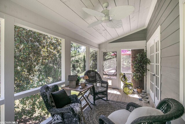 sunroom / solarium featuring ceiling fan and vaulted ceiling