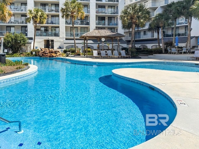 community pool with a patio