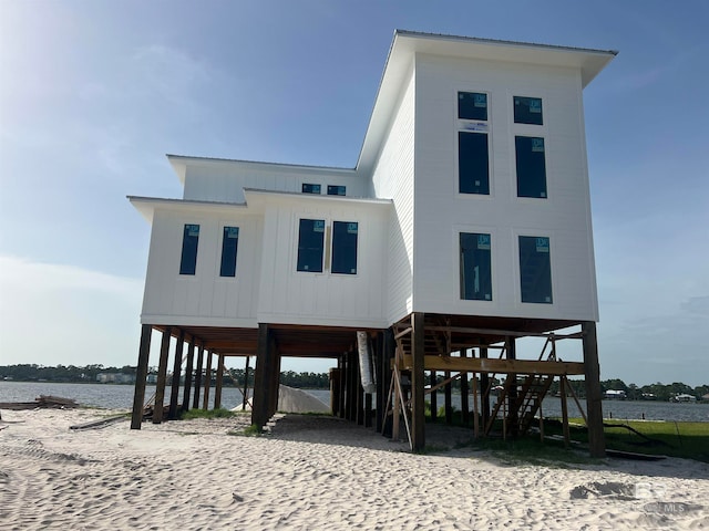 view of front of house with a water view