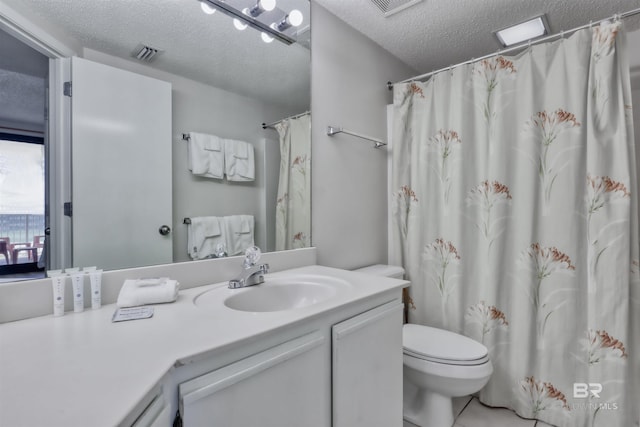 24770 Perdido Beach Blvd Unit 402, Orange Beach, AL 36561 - full bath with a textured ceiling, vanity, and toilet