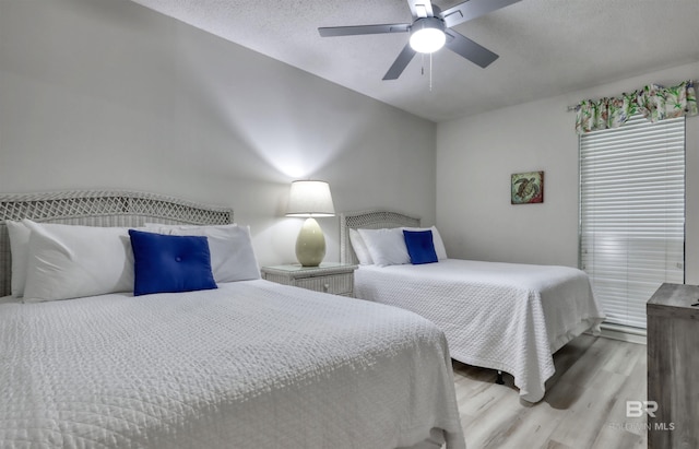 24770 Perdido Beach Blvd Unit 402, Orange Beach, AL 36561 - bedroom with wood finished floors and a ceiling fan