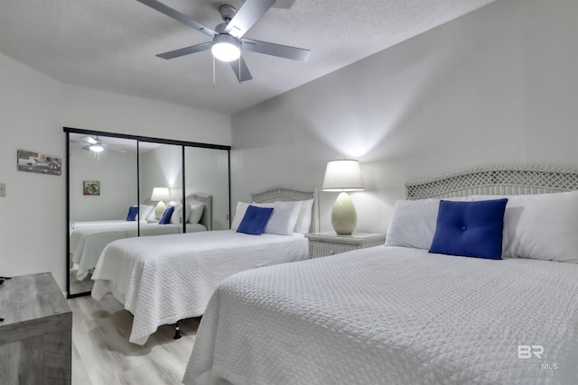 24770 Perdido Beach Blvd Unit 402, Orange Beach, AL 36561 - bedroom with wood finished floors, a closet, and a ceiling fan