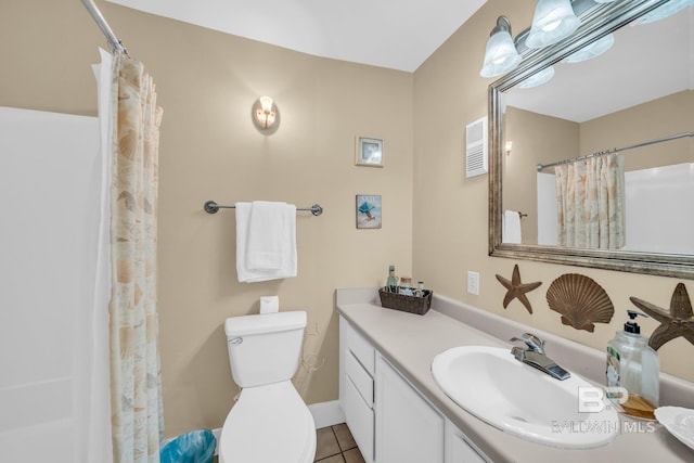 952 W Beach Blvd Unit 106, Gulf Shores, AL 36542 - full bathroom featuring vanity, tile patterned flooring, toilet, and a shower with curtain