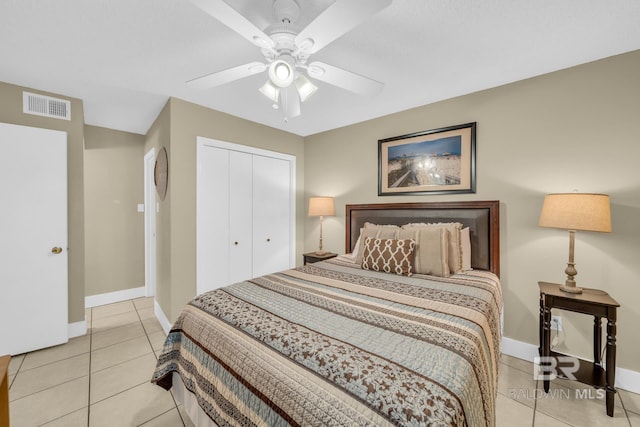 952 W Beach Blvd Unit 106, Gulf Shores, AL 36542 - bedroom featuring a closet, light tile patterned floors, baseboards, and a ceiling fan