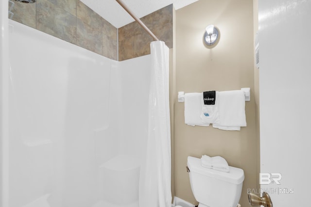 952 W Beach Blvd Unit 106, Gulf Shores, AL 36542 - bathroom with toilet and a shower with curtain