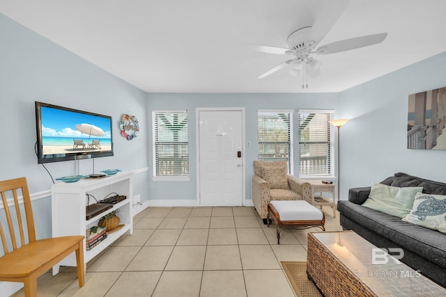 tiled living room with ceiling fan