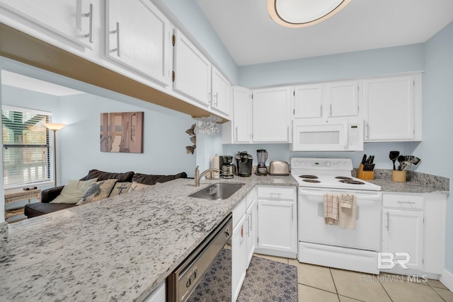 952 W Beach Blvd Unit 106, Gulf Shores, AL 36542 - kitchen with white appliances, a sink, white cabinets, light tile patterned flooring, and light stone countertops