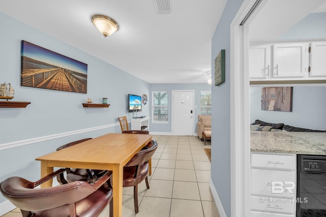 952 W Beach Blvd Unit 106, Gulf Shores, AL 36542 - dining space with light tile patterned floors and baseboards