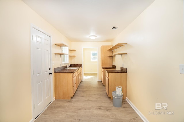 109 Palmer St, Brewton, AL 36426 - kitchen with dark countertops, visible vents, open shelves, and a sink