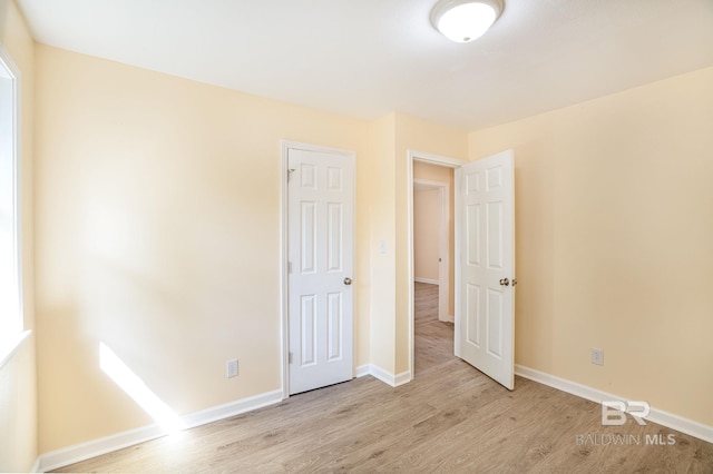 109 Palmer St, Brewton, AL 36426 - unfurnished bedroom featuring light wood-type flooring and baseboards