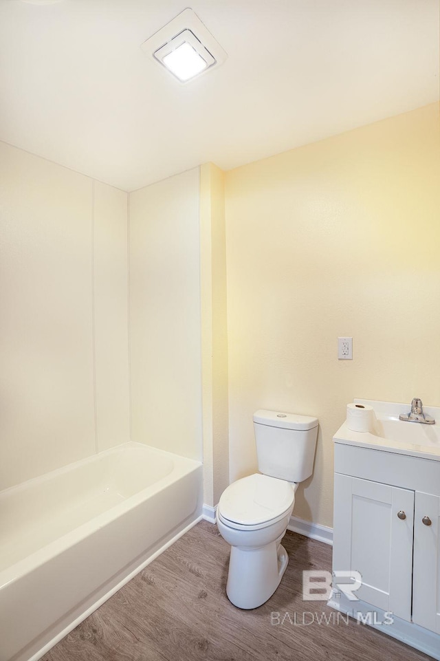 109 Palmer St, Brewton, AL 36426 - full bathroom with toilet, wood finished floors, vanity, and baseboards