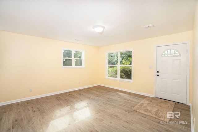 109 Palmer St, Brewton, AL 36426 - entrance foyer with wood finished floors, baseboards, and visible vents