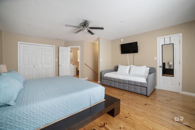 bedroom with baseboards, ceiling fan, and wood finished floors