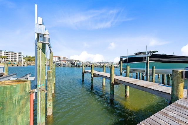 view of dock with a water view and boat lift