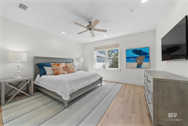 bedroom with recessed lighting, visible vents, ceiling fan, light wood-type flooring, and baseboards