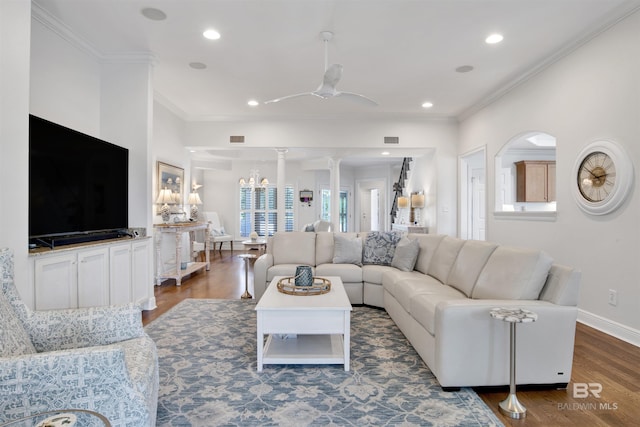 living area featuring ornamental molding, visible vents, recessed lighting, wood finished floors, and baseboards