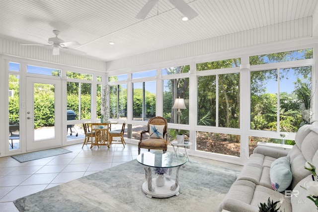 sunroom / solarium with tile patterned floors and recessed lighting