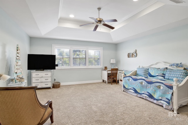 bedroom with a raised ceiling, baseboards, a ceiling fan, and carpet floors