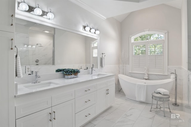 full bath featuring a shower stall, marble finish floor, a sink, and a wainscoted wall