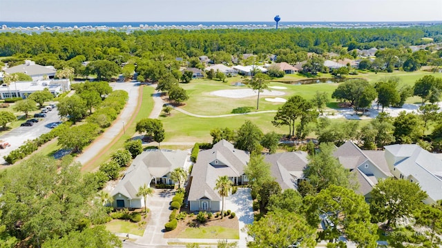bird's eye view featuring view of golf course, a residential view, and a wooded view