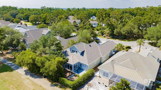 aerial view with a wooded view and a residential view