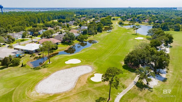 bird's eye view with a water view and view of golf course