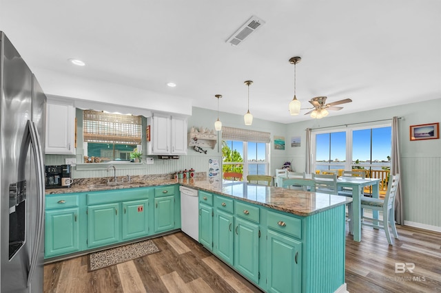 14752 State Highway 180, Gulf Shores, AL 36542 - kitchen with stainless steel fridge with ice dispenser, white dishwasher, a peninsula, a ceiling fan, and white cabinets