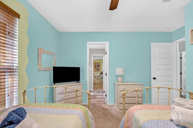 14752 State Highway 180, Gulf Shores, AL 36542 - bedroom with light colored carpet, multiple windows, and ceiling fan