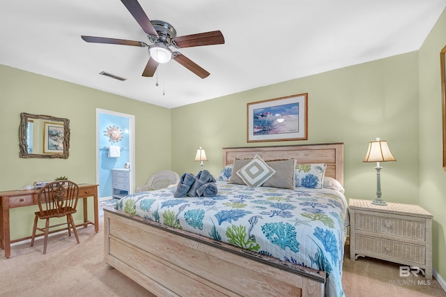 14752 State Highway 180, Gulf Shores, AL 36542 - bedroom with light carpet, ensuite bath, and ceiling fan