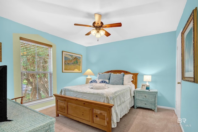 14752 State Highway 180, Gulf Shores, AL 36542 - bedroom featuring light carpet and ceiling fan