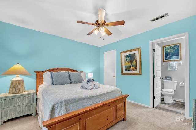 14752 State Highway 180, Gulf Shores, AL 36542 - bedroom with light carpet, connected bathroom, and a ceiling fan