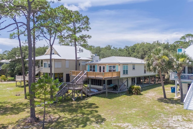 14752 State Highway 180, Gulf Shores, AL 36542 - back of house with stairs, a wooden deck, and a yard